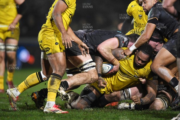 310126 - Ospreys v Dragons RFC - United Rugby Championship - Levi Douglas of Dragons is challenged by Ryan Smith of Ospreys