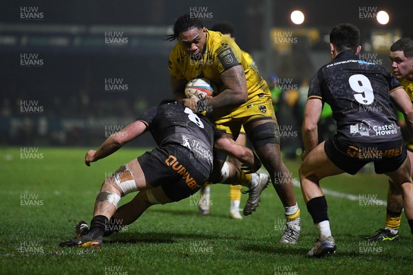 310126 - Ospreys v Dragons RFC - United Rugby Championship - Levi Douglas of Dragons is challenged by Morgan Morse of Ospreys