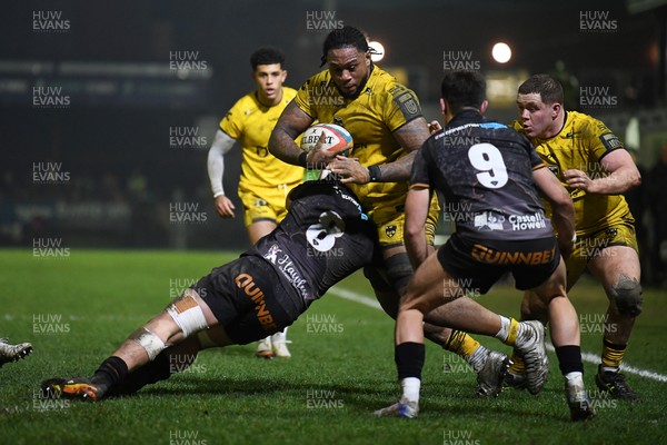 310126 - Ospreys v Dragons RFC - United Rugby Championship - Levi Douglas of Dragons is challenged by Morgan Morse of Ospreys