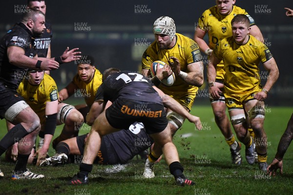 310126 - Ospreys v Dragons RFC - United Rugby Championship - Harri Keddie of Dragons is challenged by Keiran Williams of Ospreys