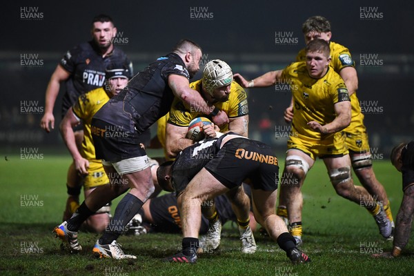 310126 - Ospreys v Dragons RFC - United Rugby Championship - Harri Keddie of Dragons is challenged by Keiran Williams of Ospreys