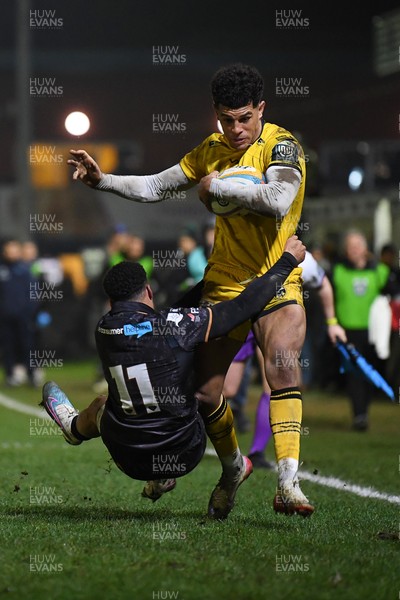 310126 - Ospreys v Dragons RFC - United Rugby Championship - Rio Dyer of Dragons is challenged by Keelan Giles of Ospreys