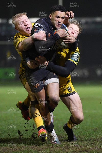310126 - Ospreys v Dragons RFC - United Rugby Championship - Keelan Giles of Ospreys is challenged by Tinus De Beer of Dragons