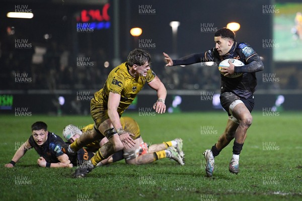 310126 - Ospreys v Dragons RFC - United Rugby Championship - Keelan Giles of Ospreys is challenged by Ryan Woodman of Dragons