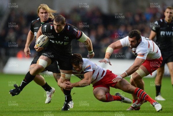 210913 - Ospreys v Edinburgh - RaboDirect PRO12 -Morgan Allen of Ospreys takes on Nick De Luca and Dimitri Basilaia of Edinburgh