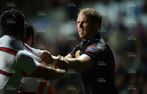 210913 - Ospreys v Edinburgh - RaboDirect PRO12 -Alun Wyn Jones of Ospreys holds off Edinburgh players