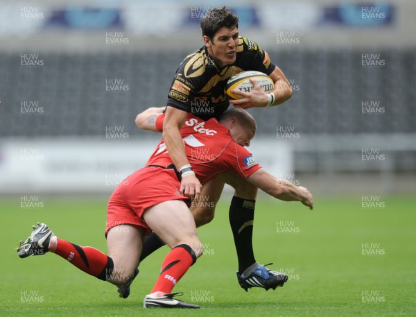 04.10.09 - Ospreys v Edinburgh - Magners League - Ospreys' James Hook is tackled by Edinburgh's Steve Jones. 