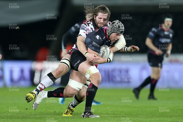 190216 - Ospreys v Edinburgh - Guinness PRO12 - Dan Lydiate of Ospreys is tackled by Ben Toolis of Edinburgh