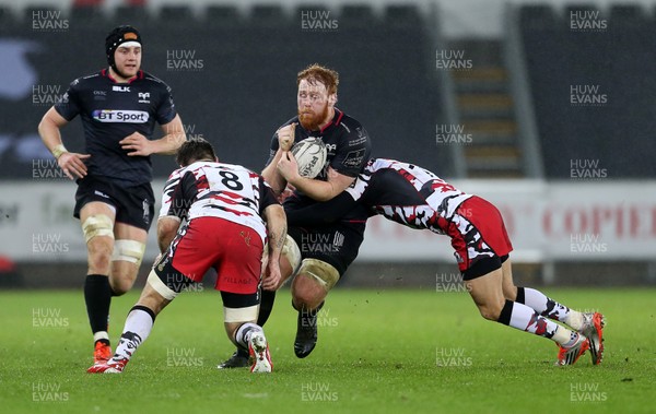 190216 - Ospreys v Edinburgh - Guinness PRO12 - Dan Baker of Ospreys is tackled by Cornell Du Preez and Tom Brown of Edinburgh