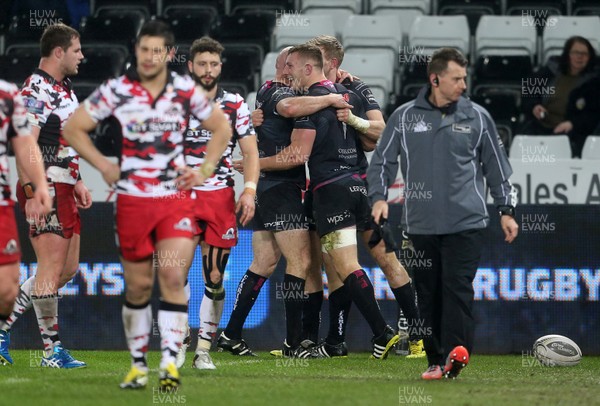 190216 - Ospreys v Edinburgh - Guinness PRO12 - Sam Underhill of Ospreys celebrates with team mates after scoring a try