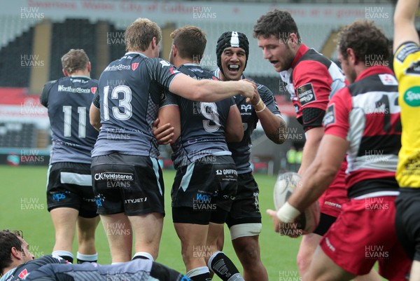 210914 - Ospreys v Edinburgh - Guinness PRO12 - Rhys Webb of Ospreys celebrates with team mates after scoring his second try 