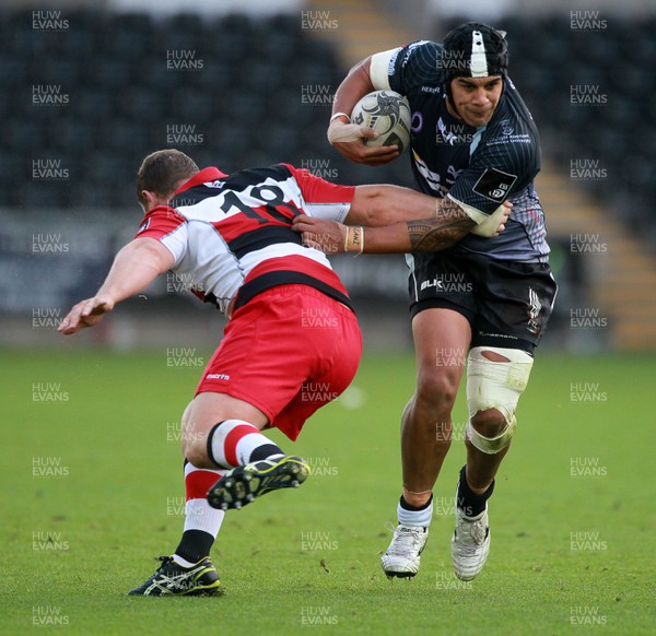 210914 - Ospreys v Edinburgh - Guinness PRO12 - Josh Matavesi of Ospreys is tackled by John Andress of Edinburgh  