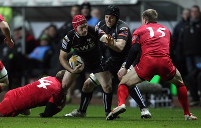 220213 - Ospreys v Edinburgh Rugby, RaboDirect PRO12 - Ospreys Richard Fussell is tackled by Edinburgh's Dougie Fife