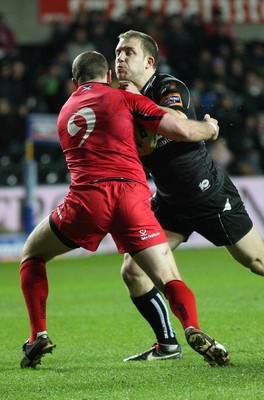 220213 - Ospreys v Edinburgh Rugby, RaboDirect PRO12 - Ospreys Tom Isaacs takes on Edinburgh's Richie Rees