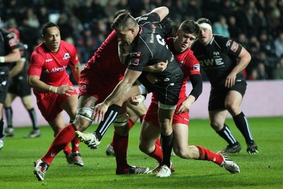 220213 - Ospreys v Edinburgh Rugby, RaboDirect PRO12 - Ospreys Rhys Webb is held by the Edinburgh defence