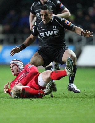 220213 - Ospreys v Edinburgh Rugby, RaboDirect PRO12 - Ospreys Kahn Fotuali'i gets hold of Edinburgh's Andy Titterrell