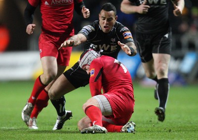 220213 - Ospreys v Edinburgh Rugby, RaboDirect PRO12 - Ospreys Kahn Fotuali'i gets hold of Edinburgh's Andy Titterrell