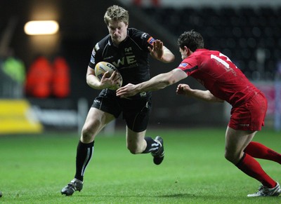 220213 - Ospreys v Edinburgh Rugby, RaboDirect PRO12 - Ospreys Jonathan Spratt is tackled by Edinburgh's Nick De Luca