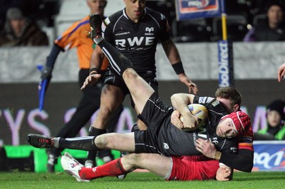 220213 - Ospreys v Edinburgh Rugby, RaboDirect PRO12 - Ospreys Richard Fussell is tackled