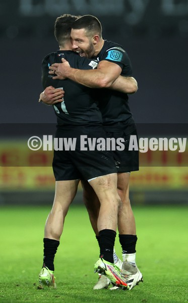 290122 - Ospreys v Edinburgh - United Rugby Championship - Rhys Webb and Luke Morgan of Ospreys celebrate at full time