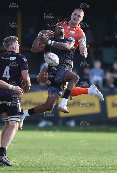 261024 - Ospreys v Edinburgh Rugby, United Rugby Championship - Dan Kasende of Ospreys and Duhan van der Merwe of Edinburgh compete for the ball