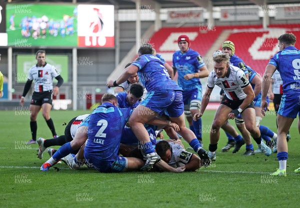 081224 - Ospreys v Emirates Lions, EPCR Challenge Cup - Franco Marais of Lions is pushed over the line to score a try