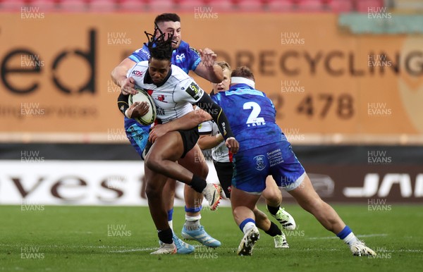 081224 - Ospreys v Emirates Lions, EPCR Challenge Cup - Rabz Maxwane of Lions is tackled by Gareth Thomas and Dewi Lake of Ospreys 