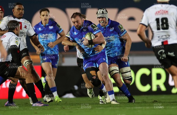 081224 - Ospreys v Emirates Lions, EPCR Challenge Cup - Sam Parry of Ospreys is tackled by Nico Steyn of Lions 