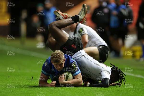 081224 - Ospreys v Emirates Lions, EPCR Challenge Cup - Jac Morgan of Ospreys is tackled by Rabz Maxwane of Lions 