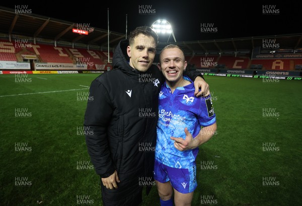 081224 - Ospreys v Emirates Lions, EPCR Challenge Cup - Kieran Hardy and Luke Davies of Ospreys 