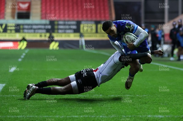 081224 - Ospreys v Emirates Lions, EPCR Challenge Cup - Keelan Giles of Ospreys is tackled by Tapiwa Mafura of Lions 