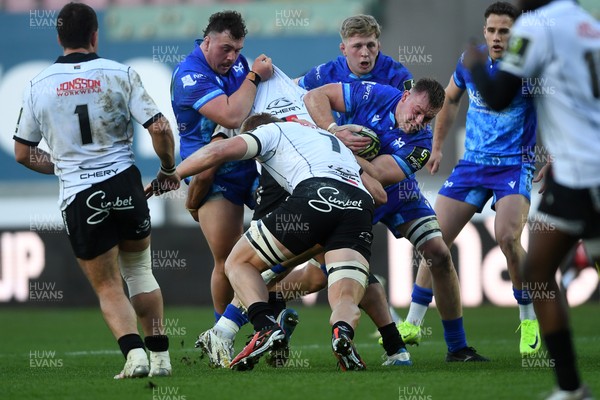 081224 - Ospreys v Emirates Lions -  EPCR Challenge Cup - Dewi Lake of Ospreys is challenged by Izan Esterhuizen of Emirates Lions