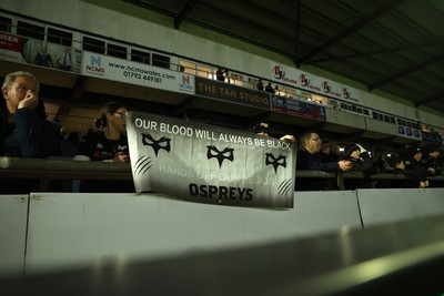 230126 - Ospreys v Emirates Lions - United Rugby Championship - Ospreys fans protest the potential changes to Welsh Rugby during the game on the 11th minute