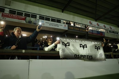 230126 - Ospreys v Emirates Lions - United Rugby Championship - Ospreys fans protest the potential changes to Welsh Rugby during the game on the 11th minute