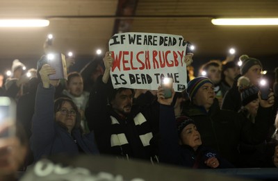 230126 - Ospreys v Emirates Lions - United Rugby Championship - Ospreys fans protest the potential changes to Welsh Rugby during the game on the 11th minute