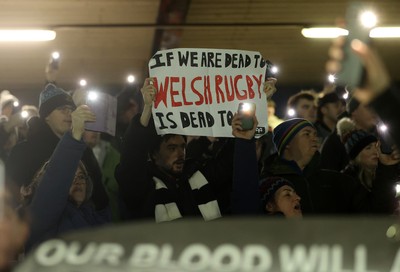 230126 - Ospreys v Emirates Lions - United Rugby Championship - Ospreys fans protest the potential changes to Welsh Rugby during the game on the 11th minute