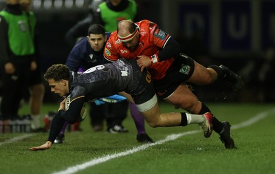 230126 - Ospreys v Emirates Lions - United Rugby Championship - Kieran Hardy of Ospreys is tackled by PJ Botha of Lions 