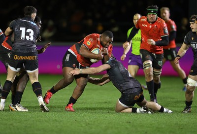 230126 - Ospreys v Emirates Lions - United Rugby Championship - Asenathi Ntlabakanye of Lions is tackled by Dewi Lake of Ospreys 