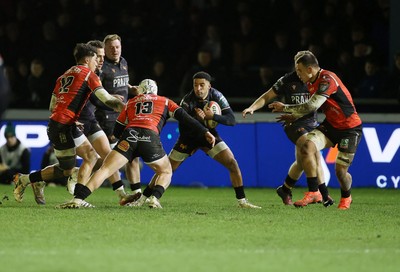 230126 - Ospreys v Emirates Lions - United Rugby Championship - Keelan Giles of Ospreys is challenged by Henco van Wyk of Lions 