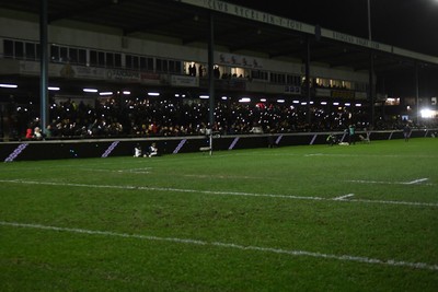 230126 - Ospreys v Emirates Lions - United Rugby Championship - Ospreys fans shine their phone lights in protest in the 11th minute