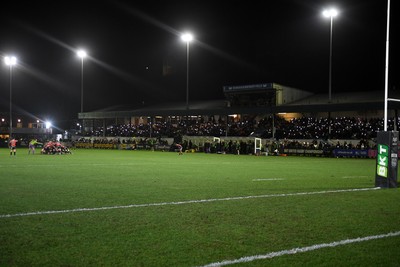 230126 - Ospreys v Emirates Lions - United Rugby Championship - Ospreys fans shine their phone lights in protest in the 11th minute