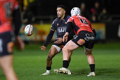 230126 - Ospreys v Emirates Lions - United Rugby Championship - Kieran Hardy of Ospreys is challenged by Henco Van Wyk of Lions