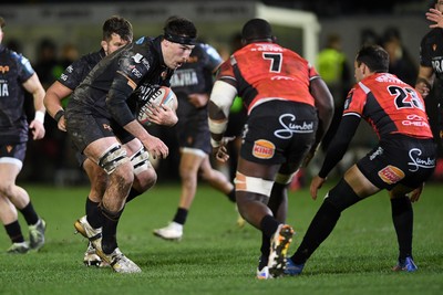 230126 - Ospreys v Emirates Lions - United Rugby Championship - Ryan Smith of Ospreys is challenged by Batho Hlekani of Lions