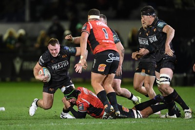 230126 - Ospreys v Emirates Lions - United Rugby Championship - Dewi Lake of Ospreys is challenged by Morne Van Den Berg of Lions