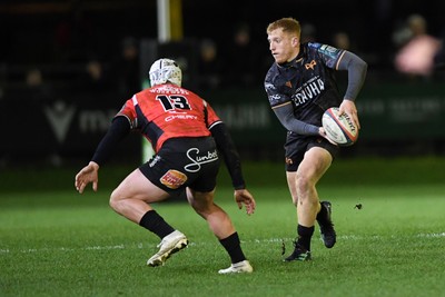 230126 - Ospreys v Emirates Lions - United Rugby Championship - Iestyn Hopkins of Ospreys is challenged by Henco Van Wyk of Lions