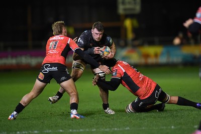 230126 - Ospreys v Emirates Lions - United Rugby Championship - James Ratti of Ospreys is challenged by Richard Kriel of Lions