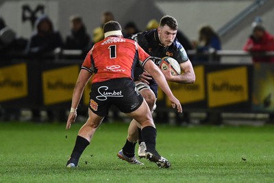 230126 - Ospreys v Emirates Lions - United Rugby Championship - James Ratti of Ospreys is challenged by SJ Kotze of Lions