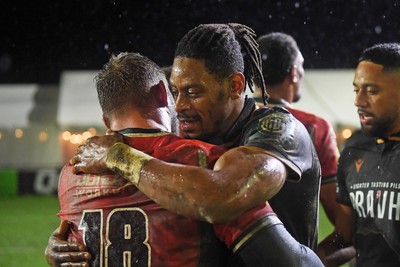 230126 - Ospreys v Emirates Lions - United Rugby Championship - Dan Kasende of Ospreys and Conrad Van Vuuren of Lions at full time