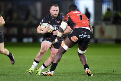 230126 - Ospreys v Emirates Lions - United Rugby Championship - Steffan Thomas of Ospreys is challenged by Batho Hlekani of Lions