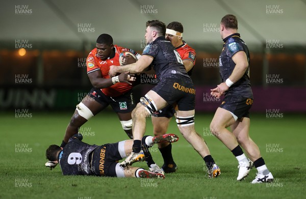 230126 - Ospreys v Emirates Lions - United Rugby Championship - Bathobele Hlekani of Lions is tackled by Kieran Hardy of Ospreys 